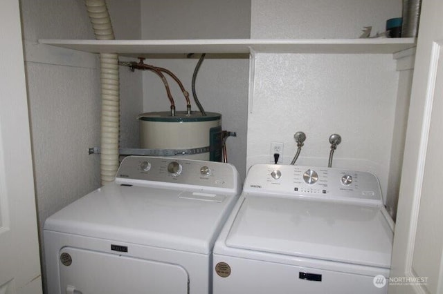 washroom featuring independent washer and dryer and water heater