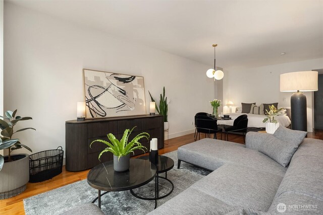 2911 2nd Ave Unit 411, Seattle, WA 98121 - living room featuring wood finished floors