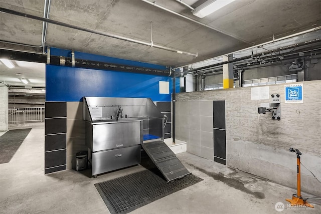 2911 2nd Ave Unit 411, Seattle, WA 98121 - misc room featuring unfinished concrete flooring