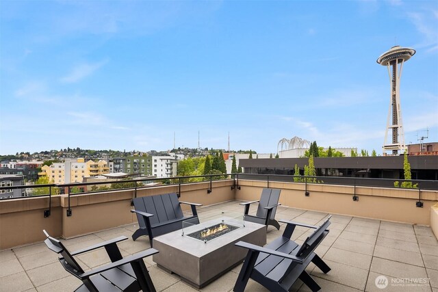 2911 2nd Ave Unit 411, Seattle, WA 98121 - view of patio featuring an outdoor fire pit