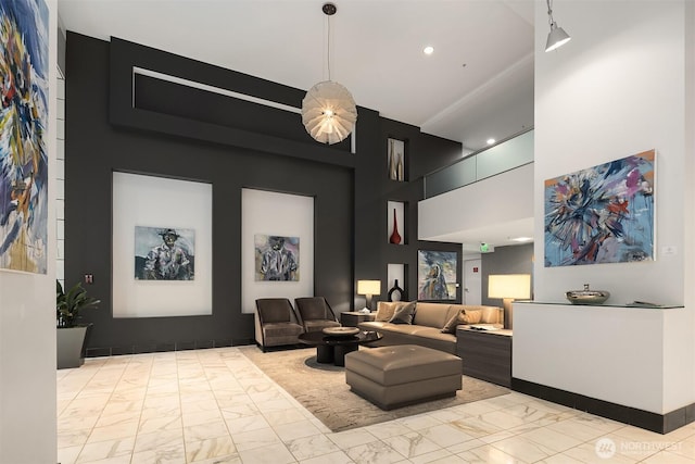 2911 2nd Ave Unit 411, Seattle, WA 98121 - building lobby featuring a towering ceiling and recessed lighting