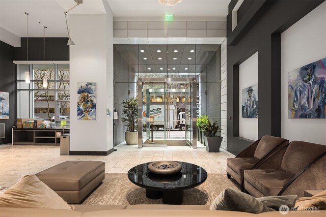 2911 2nd Ave Unit 411, Seattle, WA 98121 - common area featuring a towering ceiling and recessed lighting