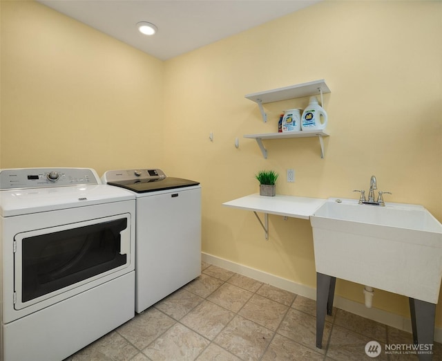 11607 SW Cove Rd, Vashon, WA 98070 - laundry room with washer and dryer and baseboards