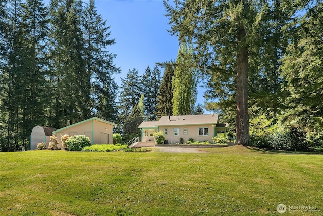 11607 SW Cove Rd, Vashon, WA 98070 - view of grassy yard featuring an outbuilding and a storage shed