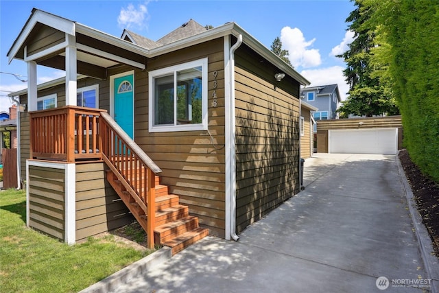 9348 54th Ave S, Seattle, WA 98118 - view of front of property featuring a garage and an outdoor structure