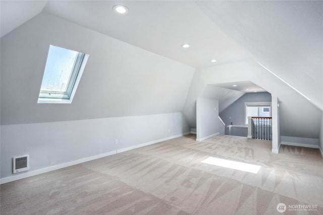 9348 54th Ave S, Seattle, WA 98118 - additional living space featuring lofted ceiling, a skylight, carpet, recessed lighting, and baseboards