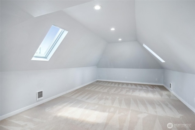 9348 54th Ave S, Seattle, WA 98118 - bonus room featuring a skylight, vaulted ceiling, baseboards, light colored carpet, and recessed lighting