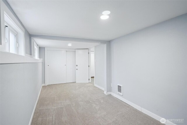 9348 54th Ave S, Seattle, WA 98118 - corridor featuring carpet floors, baseboards, and recessed lighting