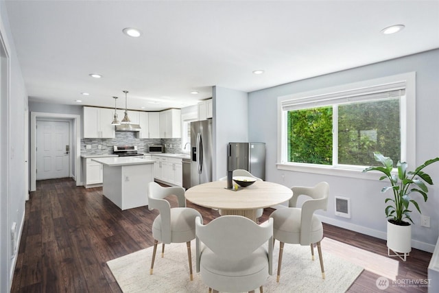 9348 54th Ave S, Seattle, WA 98118 - dining space featuring recessed lighting, baseboards, and dark wood finished floors