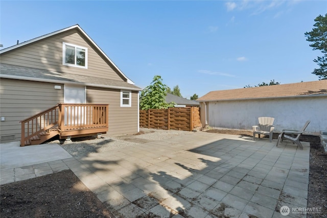 9348 54th Ave S, Seattle, WA 98118 - back of house with a patio and roof with shingles
