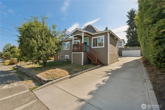 9348 54th Ave S, Seattle, WA 98118 - bungalow-style house with an outbuilding, a garage, and a front lawn