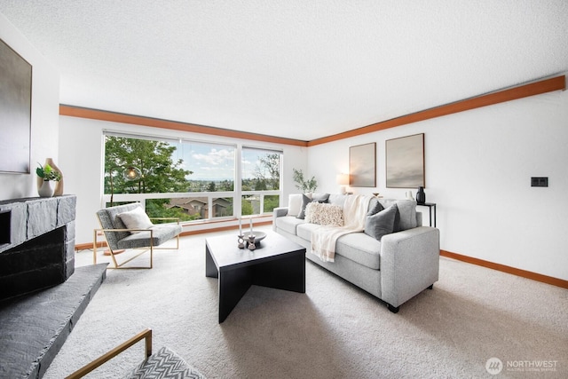 carpeted living room with baseboards and a fireplace