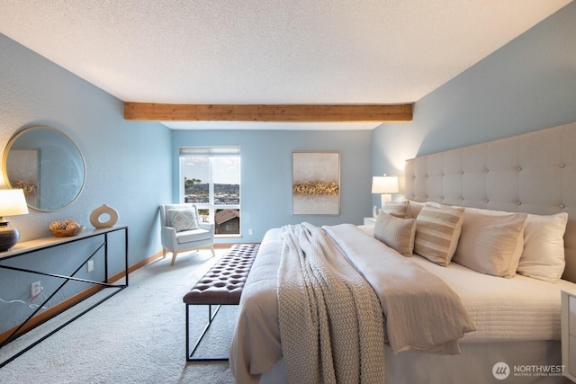 bedroom featuring carpet floors, beamed ceiling, and baseboards