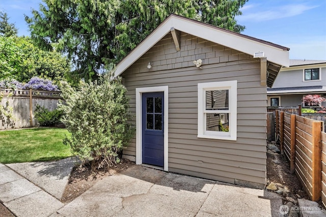 view of outbuilding featuring an outdoor structure and a fenced backyard