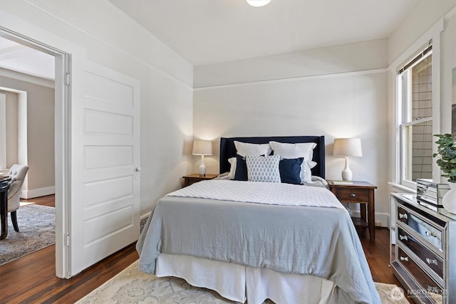 bedroom featuring dark wood-style floors