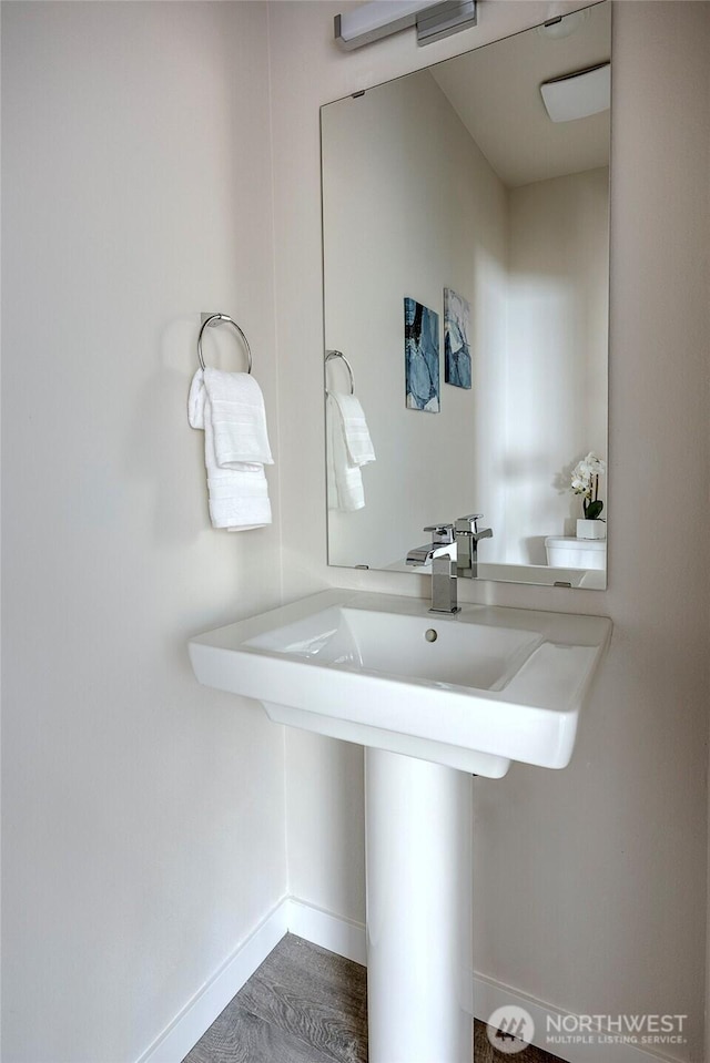 8826 NE 173rd Pl Unit B, Bothell, WA 98011 - bathroom with baseboards and a sink