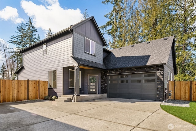 7506 172nd Street Ct E, Puyallup, WA 98375 - contemporary house featuring driveway, fence, a shingled roof, and a garage
