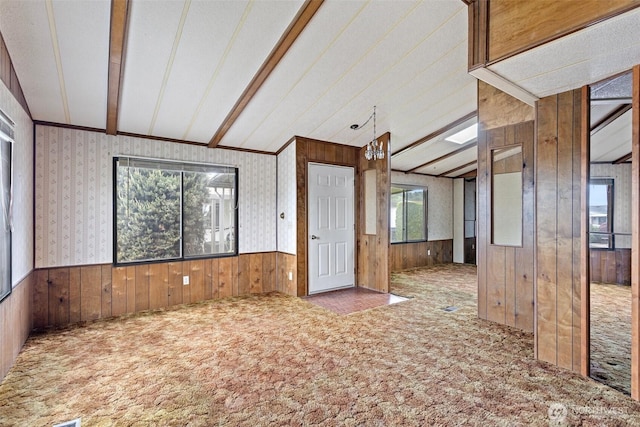 1402 22nd St NE Unit 406, Auburn, WA 98002 - carpeted spare room with wood walls, vaulted ceiling, and wainscoting