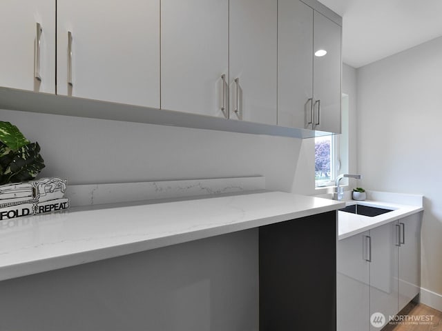 23801 100th Ave SE, Kent, WA 98031 - kitchen with modern cabinets, light stone counters, gray cabinetry, and light wood-style flooring