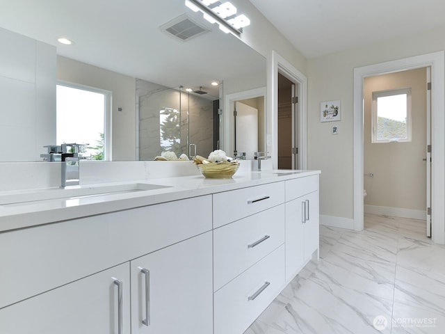 23801 100th Ave SE, Kent, WA 98031 - bathroom featuring double vanity, a stall shower, healthy amount of natural light, marble look tiles, and recessed lighting