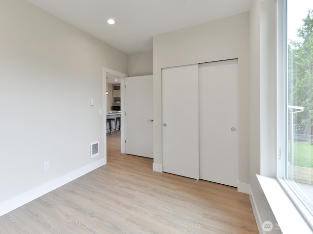 23801 100th Ave SE, Kent, WA 98031 - unfurnished bedroom featuring light wood-style flooring, recessed lighting, and a closet