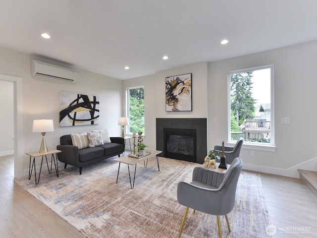 23801 100th Ave SE, Kent, WA 98031 - living room featuring an AC wall unit, wood finished floors, healthy amount of natural light, and recessed lighting