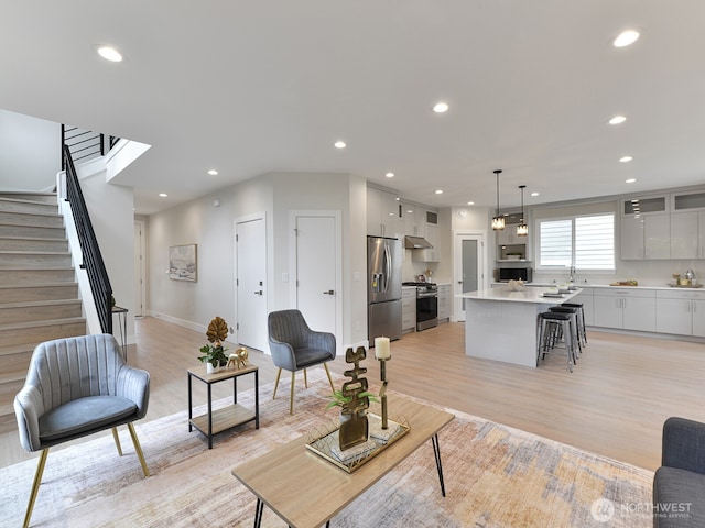 23801 100th Ave SE, Kent, WA 98031 - living room featuring light wood-type flooring, stairs, and recessed lighting