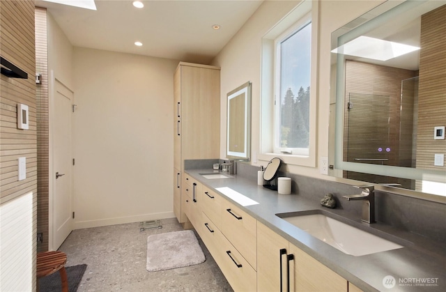 3139 Saratoga Rd, Langley, WA 98260 - bathroom with baseboards, double vanity, and recessed lighting