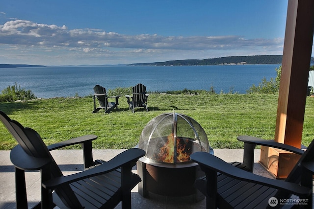 3139 Saratoga Rd, Langley, WA 98260 - view of patio featuring a water view and a fire pit