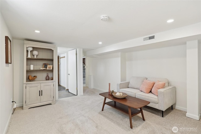 living room featuring light carpet, recessed lighting, and baseboards