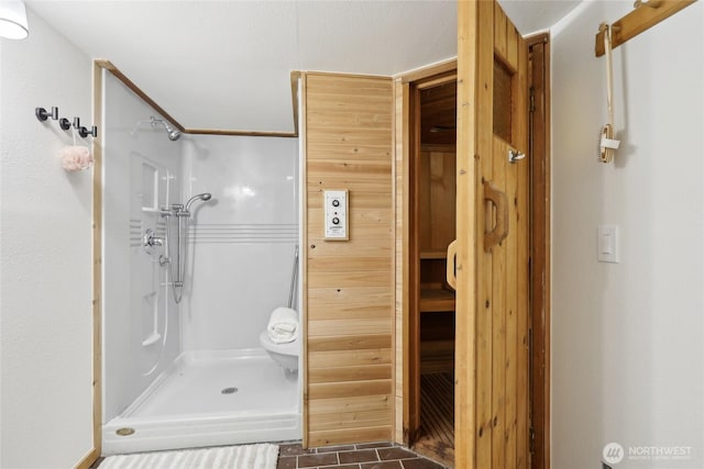 bathroom with a shower and tile patterned floors