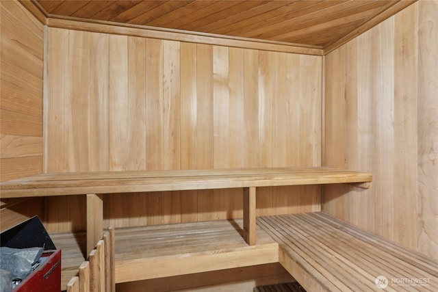 relaxing sauna / steam room featuring wooden ceiling