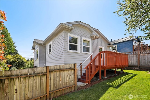 back of house featuring a deck