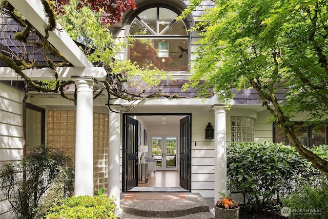 property entrance featuring french doors