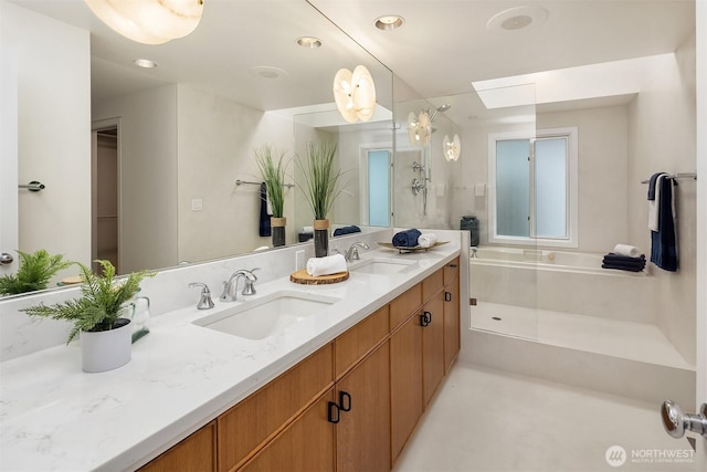 bathroom with a garden tub, double vanity, a shower, and recessed lighting