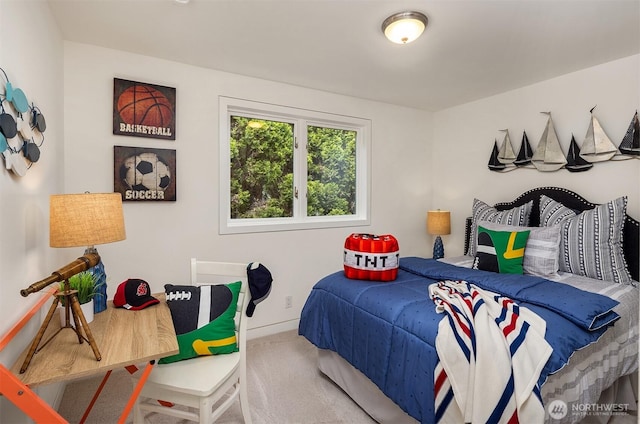 bedroom featuring carpet floors and baseboards