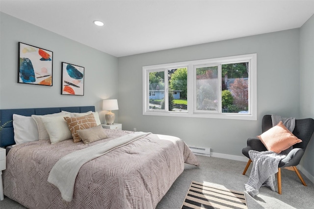 carpeted bedroom featuring baseboard heating, baseboards, and recessed lighting