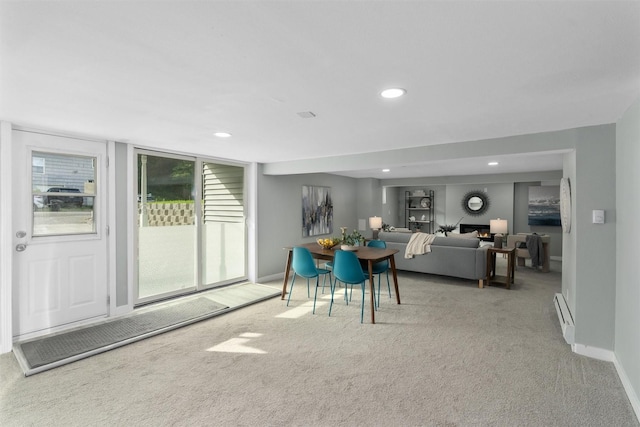 dining area featuring carpet flooring, baseboards, baseboard heating, and recessed lighting