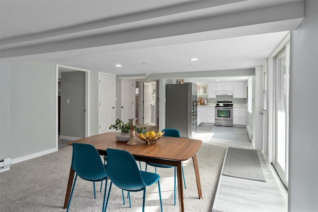 dining space with baseboards and recessed lighting