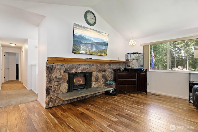 4909 95th Ave W, University Place, WA 98467 - living area featuring wood-type flooring, baseboards, and high vaulted ceiling