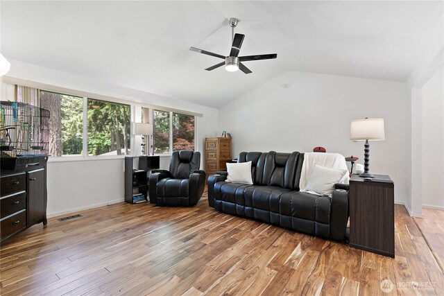 4909 95th Ave W, University Place, WA 98467 - living area featuring a ceiling fan, vaulted ceiling, light wood-type flooring, and baseboards