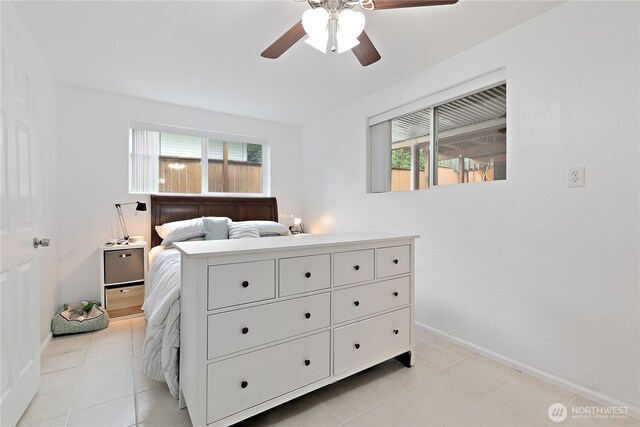 4909 95th Ave W, University Place, WA 98467 - bedroom featuring light tile patterned flooring, baseboards, and ceiling fan
