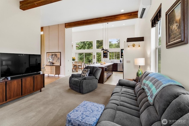 living area with an AC wall unit, a towering ceiling, beam ceiling, light carpet, and recessed lighting