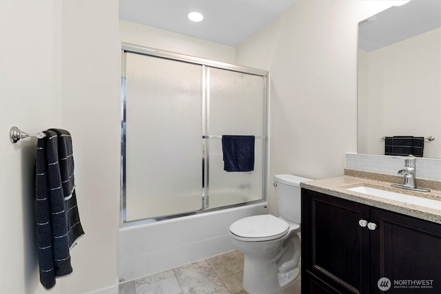 full bathroom with vanity, toilet, and bath / shower combo with glass door