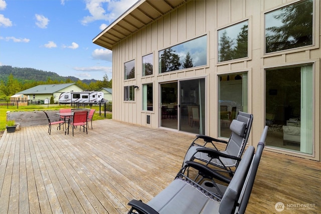 deck with outdoor dining area