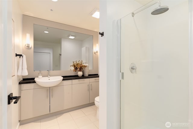 2721 1st Ave Unit 407, Seattle, WA 98121 - full bath featuring a shower stall, vanity, toilet, tile patterned flooring, and recessed lighting