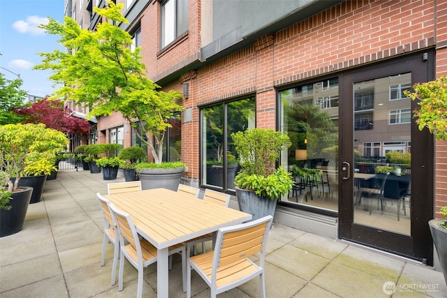 2721 1st Ave Unit 407, Seattle, WA 98121 - view of patio featuring outdoor dining area