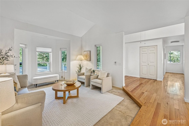 27923 NE 49th St, Redmond, WA 98053 - living room with light wood finished floors, lofted ceiling, and baseboards