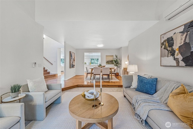 27923 NE 49th St, Redmond, WA 98053 - living room with a wall mounted AC, stairs, and light wood finished floors