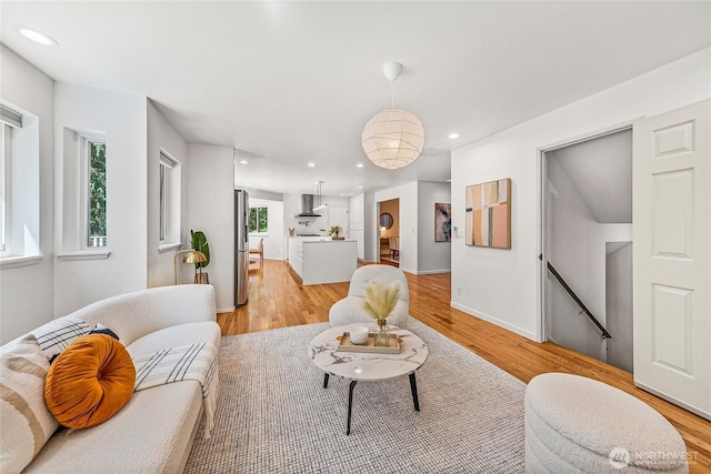 27923 NE 49th St, Redmond, WA 98053 - living area featuring light wood-style floors, recessed lighting, and baseboards